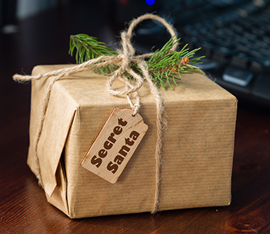 Secret Santa - What is the best way to organize a pre-Christmas gifts handout?